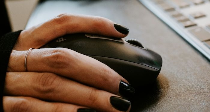 hand with nail polish clicking a mouse.jpg.optimal