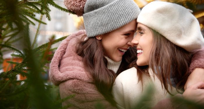 lesbian couple two women embracing christmas.jpg.optimal