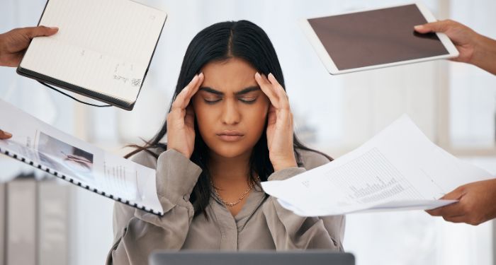 woman stressed busy multitasking.jpg.optimal