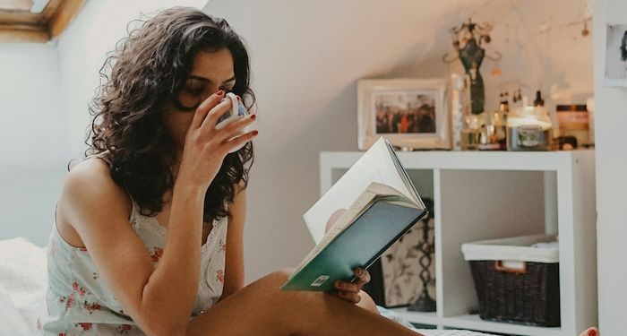 woman reading in bed 1.jpg.optimal