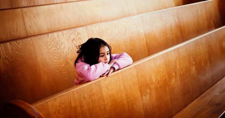girl sitting at pews